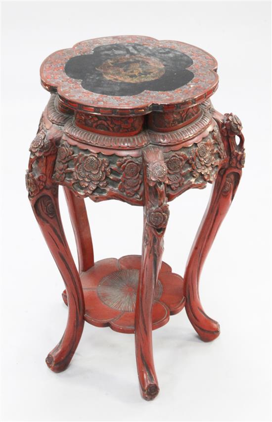 A Japanese red and black lacquer two tier stand, early 20th century, H.2ft 5.5in.